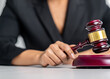 Blurred woman holding judge gavel