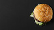 Top view of fresh beef burger on black background with copy space. Advertise Purpose. Generative AI
