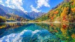 Amazing view of the Panda Lake among colorful fall forest at the Rize Valley in Jiuzhaigou nature reserve (Jiuzhai Valley National Park), China. Scenic wooded mountains and blue sky reflected in water