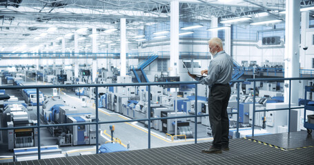 Poster - Thoughtful Middle Aged Engineer Monitoring and Analyzing Conditions at a Pristine Modern Electronics Factory with Automated Mobility Robots Working with the Help of Artificial Intelligence Software