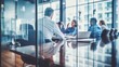 © melhak - Business Team Engaged in Discussions Seen Through Blurry Glass Partition - Negotiation Techniques, Executive Leadership, Organizational Development, Management.