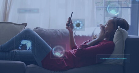 Poster - image of data processing over biracial woman using smartphone on sofa