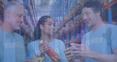 Poster - Image of financial graphs over happy diverse female and male warehouse workers with food