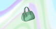 Image of green handbag on colourful background