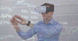 Image of trading board and graphs over caucasian businessman gesturing using vr headsets