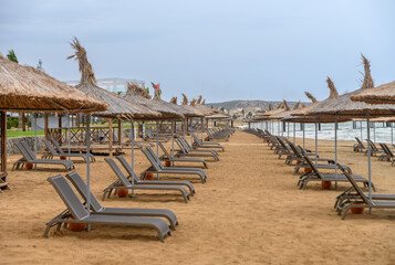 Wall Mural - beachgoers with umbrellas on the beach of the Mediterranean Sea 4