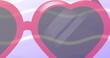 Image of pink heart shaped sunglasses on purple wavy line background