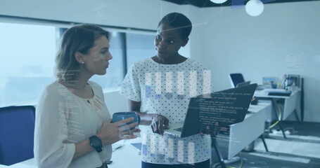 Sticker - Image of financial data processing over diverse female colleagues using laptop at office