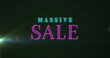 Image of massive sale text banner against light spot on black background