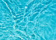 Closeup of light blue transparent clear water surface texture