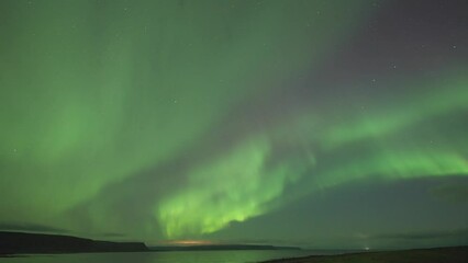 Wall Mural - The dark sky adorned with a spectacular exhibition of the northern lights.