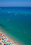 Fototapeta Sport - Sea beach with turquoise water and sand where people relax