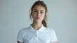 On a white background, a young woman is wearing a white polo shirt