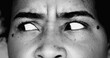© Marco - One paranoid worried young black woman macro close-up eyes looking sideways with intense preoccupation and obsession in dramatic black and white monochrome