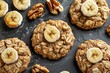 Homemade Low-Calorie Banana Oatmeal Walnut Cookies on a Slate Board. Top View of Delicious Pastry made with Organic Whole Grain. Sweet and Healthy Dessert Recipe