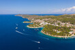 Hvar, Croatia: Aerial view of the coast lined with hotel and beach resort near the medeival Hvar old town in Croatia on a sunny summer day