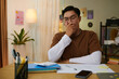 © DragonImages - High school student bored of doing homework, he is yawning and covering mouth with hand