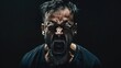 © yusufadi - Closeup portrait a grown man screaming expression in dark background. AI generated image