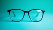 Close up view. A eyeglasses on the turquoise colour background
