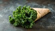 Kale chips baked to crispy perfection lightly salted and served in a paper cone