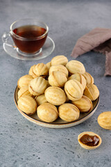 Russian cookies Nuts or Oreshki in shape of a walnut with boiled condensed milk. Russian cuisine, desserts.