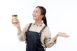 Portrait young asian barista woman wearing apron holding coffee cup and presenting isolated white background, waitress or entrepreneur cheerful and showing, small business or startup, waiter of cafe.