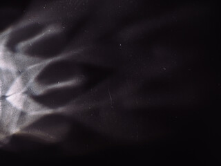 Wall Mural - light reflected on a steel surface in the dark for an abstract background, energy or mystery.