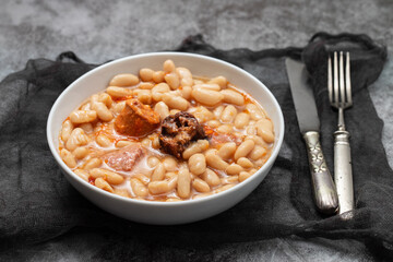 Canvas Print - fabada asturiana, a typical spanish bean stew in white bowl