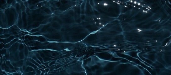 Wall Mural - Dark black water surface. Closeup of clear calm water surface texture with ripples, splashes. Dark grey water waves at night. Abstract summer banner background with Copy space, top view