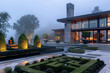 Contemporary home with topiary sculptures in the front garden, enveloped in morning fog.