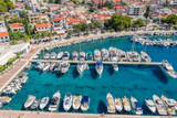 Fototapeta  - Aerial view of Baska Voda town with harbor in Makarska riviera, Dalmatia, Croatia
