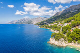 Fototapeta  - Aerial view of Punta Rata beach with boats and azure sea in Brela, Croatia, Dalmatia, Croatian azure coast