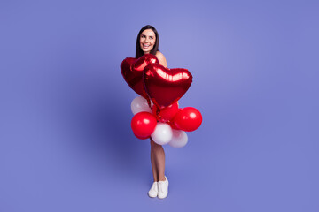 Sticker - Full length portrait of nice lady hold balloons look empty space wear dress isolated on purple color background