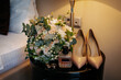 Bride's bouquet, her perfume and her shoes.
