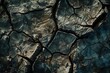 Cracked earth beneath a dried-up reservoir, underscoring the growing threat of water scarcity induced by climate change.