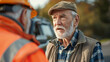 A senior man discussing the towing process with a motorist by the roadside, ensuring clear communication and customer satisfaction. , natural light, soft shadows, with copy space
