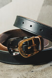 Fototapeta Łazienka - Handmade black leather belt with buckle. Belt for trousers.