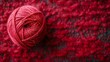 A soft, red ball of wool for knitting and crochet projects