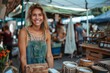 Smiling woman at farmers market stall