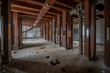 Wall Mural - Exploration of the historic old stone mill with a spiral staircase in Southern Poland, Europe, in Winter