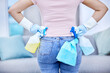 Woman, hands and cleaning products with spray bottle, rag and disinfectant for hygiene. Fluid, soap and cloth for house in home with antibacterial for bacteria reduction in living room for protect