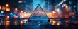 A glass pyramid with a reflection of a blurred sunset city lights in it on a reflective surface with a blurry background.