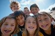 © Inigo - Group of children smiling and looking at camera on sunny day. Selective focus.