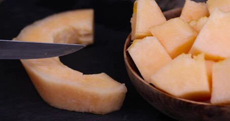 Wall Mural - sliced orange melon close-up, delicious soft and ripe food melon on the table