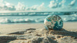 © Visual Craft - miniature globe in sand with ocean in the background, earth, discovery and world symbol (3)