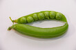 Green pea pod on a white background. sweet harvest of green peas,