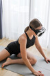 VR fit.Girl doing fitness in VR glasses at home,virtual reality exercise, immersive workout,VR sports,virtual gym