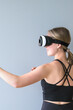 VR fit.Girl doing fitness in VR glasses at home,virtual reality exercise, immersive workout,VR sports,virtual gym
