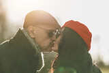 Fototapeta Na drzwi - Man and Woman Kissing in the Sun