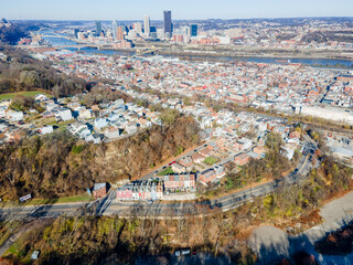 Wall Mural - Aerial cityscape with river and fall foliage in residential Pittsburgh Pennsylvania